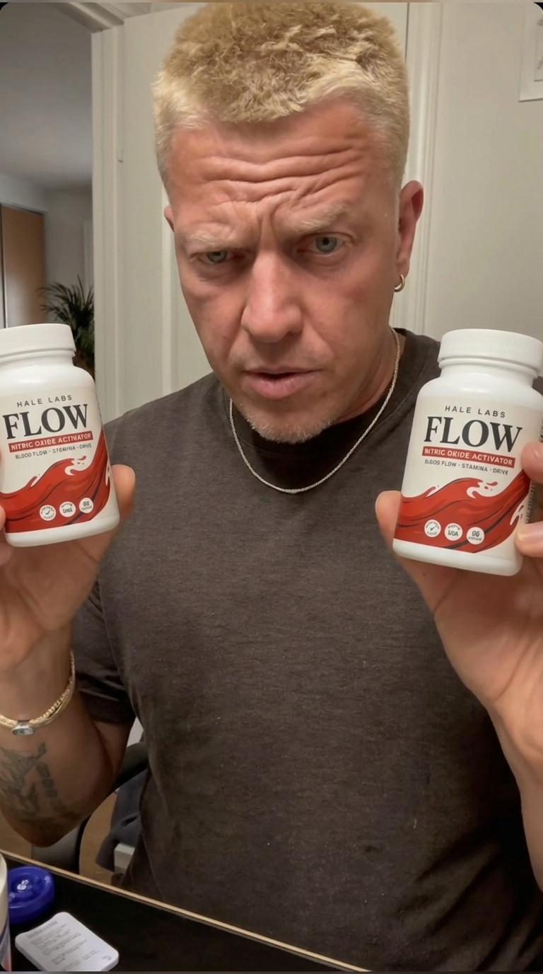 Man holding two Flow bottles